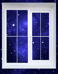 Image showing The star sky behind a window
