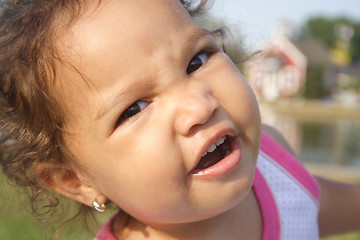 Image showing A close-up of a silly baby