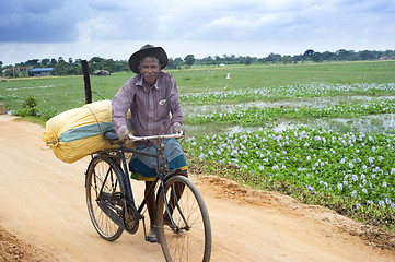 Image showing Man with bicycle