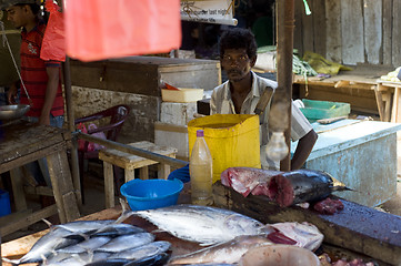 Image showing Seller at a fish  market