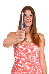 Image showing Girl showing toothbrush.