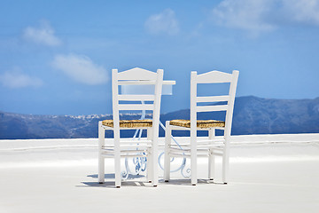 Image showing two chairs in the sun