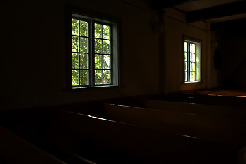 Image showing Dark rooms of church lighted by windows