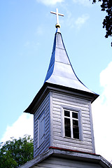 Image showing Church tower with lighted cross on roof