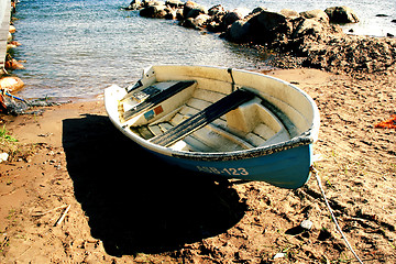 Image showing Boat on sandy beach at sunny day