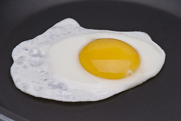 Image showing A fried egg over easy