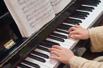 Image showing Hands playing piano