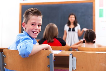 Image showing Cheerful boy in class room