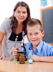 Image showing Wise boy with microscope and teacher