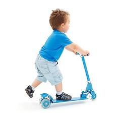 Image showing Little boy going with scooter