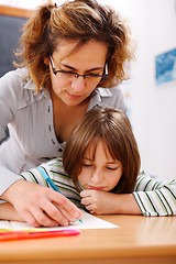 Image showing Teacher holding student's hand