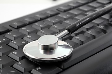 Image showing stethoscope on computer keyboard