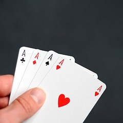 Image showing hand holding four aces