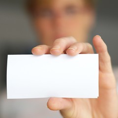 Image showing hand and blank paper with copyspace