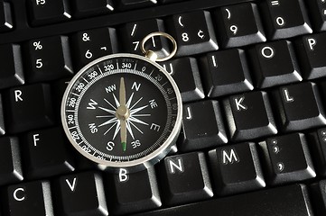 Image showing computer keyboard and compass