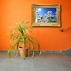 Image showing picture on a wall and plant