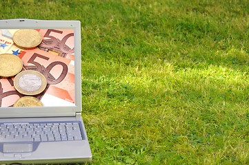 Image showing laptop and money