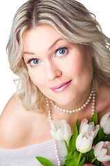 Image showing blonde woman with bouquet of tulips