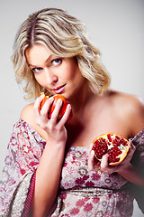 Image showing blonde woman with pomegranate