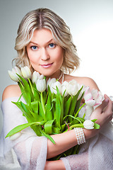 Image showing blonde woman with bouquet of tulips