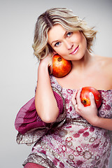 Image showing blonde woman with pomegranates