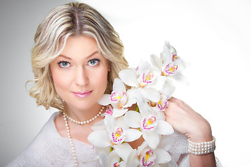 Image showing blonde woman with orchid