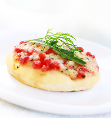 Image showing Cheesy cakes with ham and rocket