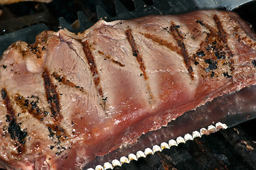 Image showing Steak in barbecue grill