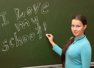 Image showing Girl schoolgirl meets an English lesson