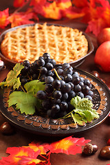 Image showing Red grapes and apple pie