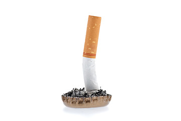 Image showing Cigarette butt and ash in a bottle cap