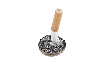 Image showing Cigarette butt and ash in a bottle cap