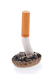 Image showing Cigarette butt and ash in a bottle cap