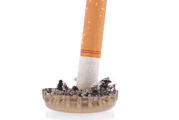 Image showing Cigarette butt and ash in a bottle cap