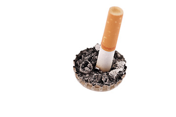 Image showing Cigarette butt and ash in a bottle cap