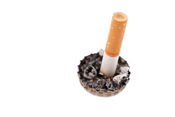 Image showing cigarette butt in a bottle cap on white background