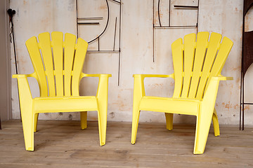 Image showing Two yellow chairs on a porch