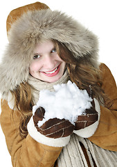 Image showing Playful winter girl holding snow