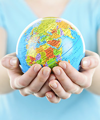 Image showing Hands holding globe