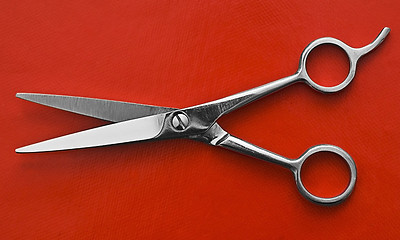 Image showing Scissors on red background