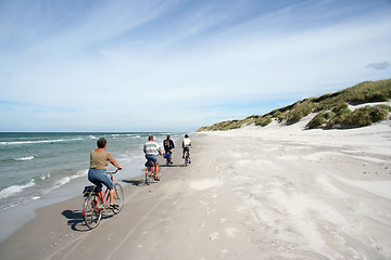 Image showing Biking on the beach
