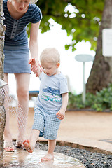 Image showing mother helping son