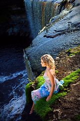 Image showing beautiful girl on brink of river waterfalls