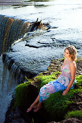 Image showing beautiful girl on brink of river waterfalls