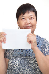 Image showing Concept photo of Asian woman holding a white card