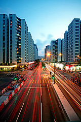 Image showing traffic in downtown at sunset moment