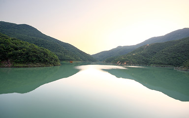 Image showing beautiful sunset over mountain lake