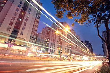 Image showing traffic in downtown at sunset moment