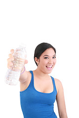 Image showing woman in sportswear drinking water, isolated on white 