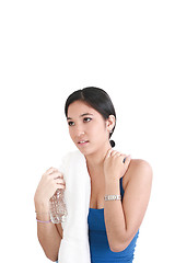 Image showing young woman with a bottle of water, isolated on white 